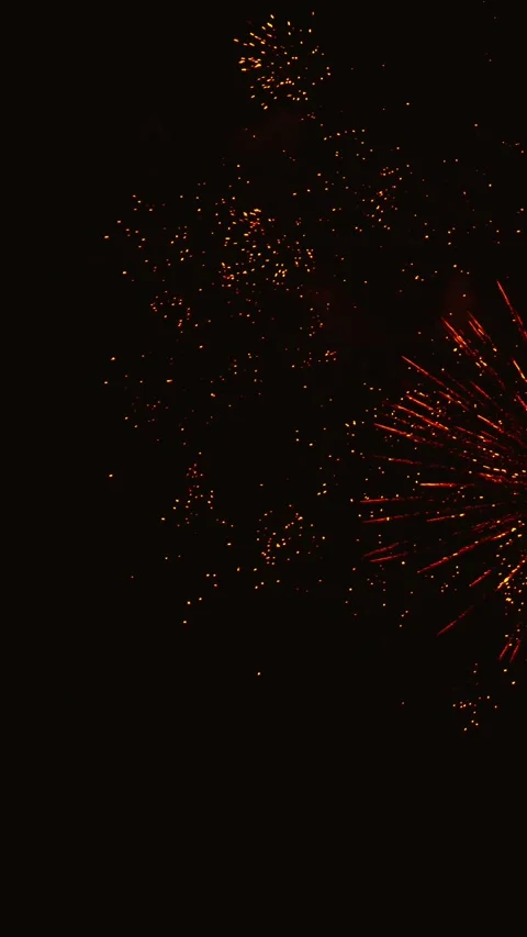 Golden fireworks exploding during a night celebration Video stock 343160171