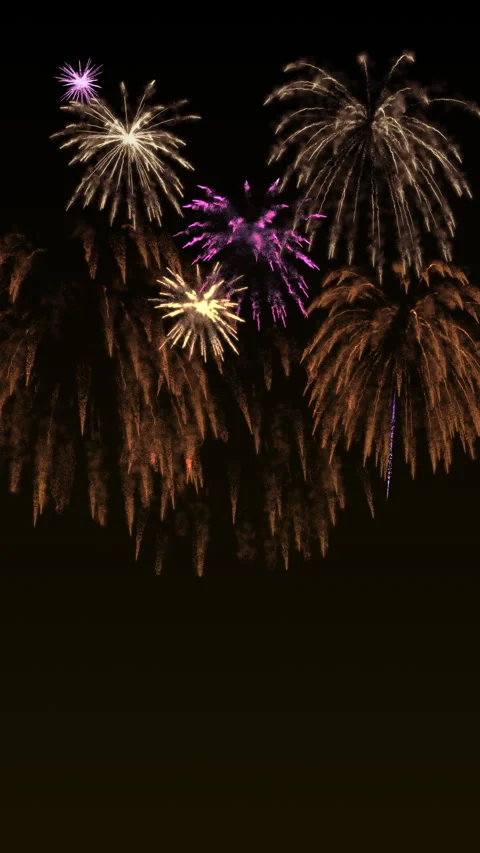 Golden fireworks exploding in a night sky with sparkling bokeh glow 動画素材 326714590