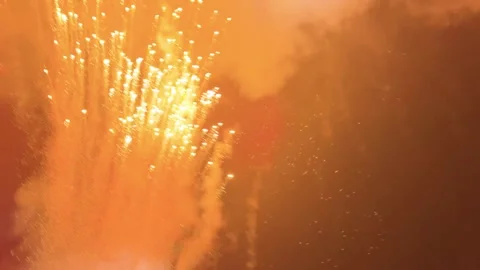 Golden Fireworks Exploding in Night Sky with Smoke and DJ flicker lights Stock Footage 329456789