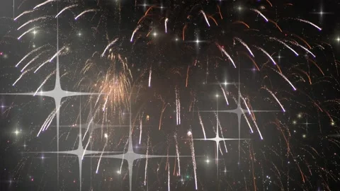 Golden fireworks exploding in the night sky with animated sparkling star Stock Footage 345852730