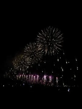 Golden fireworks exploding in night sky at Cannes 库存照片