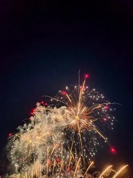 Golden fireworks exploding in night sky at Cannes Fotos de archivo