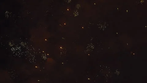 Golden Fireworks Exploding in Smoky Sky Stock Footage 330044170