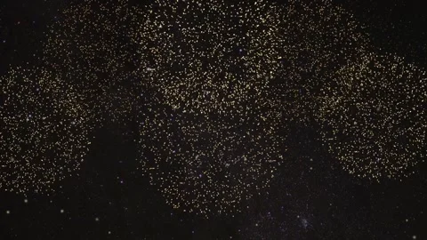 Golden fireworks exploding in starry night sky with shimmering light trails.. Stock Footage 334093656