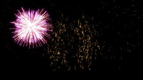 Golden fireworks explosion in night sky with bright glowing sparks and dynamic Stock Footage 344369103