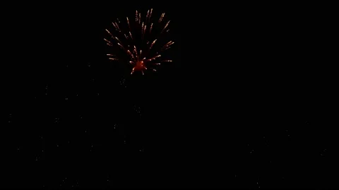 Golden flashes of firework in the night sky, slow motion. Stock Footage 167525053