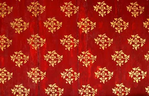 Golden flower pattern on red background. Stock Photos