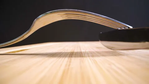 The golden fork on top of the sharp knife Stock Footage 138537100