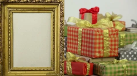 Golden frame on the background of gift boxes with bows Stock Footage 57313006