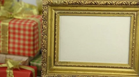 Golden frame on the background of gift boxes with bows Stock Footage 57313101