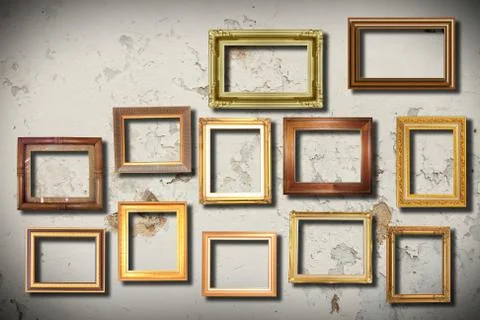 Golden frame on old wall . Stock Photos