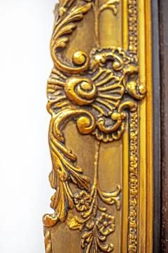 Golden frame profile with a plaster pattern in the Baroque style Stock Photos