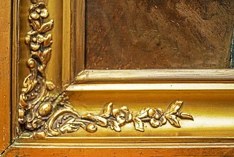 Golden frame profile with a plaster pattern on the corner Stock Photos