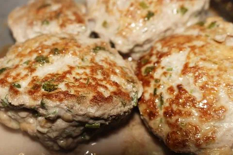Golden fried chicken cutlets with fresh herbs on a pan for healthy dinner 스톡 사진