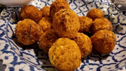 Golden Fried Snack Balls Served on a Decorative Plate Video stock 342945702