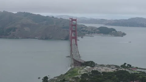 Golden Gate Bridge Aerial Pullback Marin Headlands Coastal Road Overcast Video stock 344915866