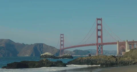 Golden gate bridge by Baker beach at sunset Video stock 69259219