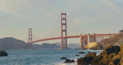 Golden gate bridge by Baker beach with a beautiful sunset Video stock 69260756