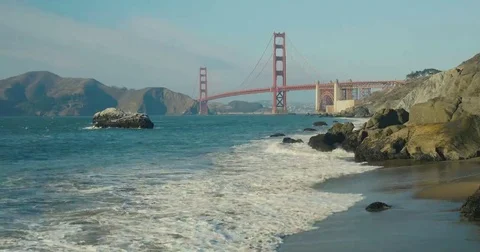 Golden gate bridge by Baker beach with a beautiful sunset Video stock 69261304