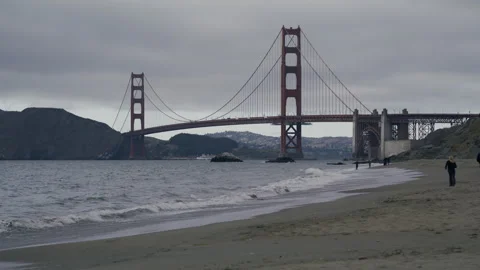 Golden Gate Bridge Beach Foreground Multiple Walkers Overcast Wide Video stock 344950314