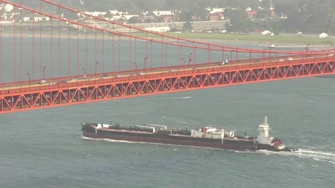 Golden Gate Bridge with cargo ship underneath, sunny, dry Stock Footage 76321042