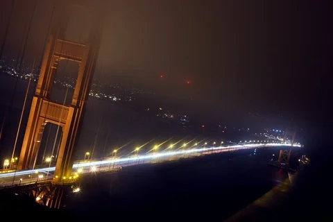 Golden Gate bridge long exposure time lapse at night with light streaks and fog Stock Footage 107634010