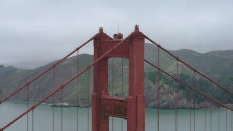 Golden Gate Bridge North Tower Aerial Drone Pullback Bay Below Overcast Video stock 344918878