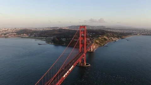 Golden Gate Bridge Rotating Drone Shot - Downtown in background Stock Footage 129857515