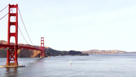 The Golden Gate Bridge in San Francisco and a passing yacht Stock Footage 197819255