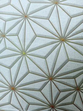 Golden geometric pattern with diamond shapes on white background. Foto stock