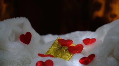 A golden gift box and red hearts. Wedding, Birthday, Valentines Stock Footage 299653381