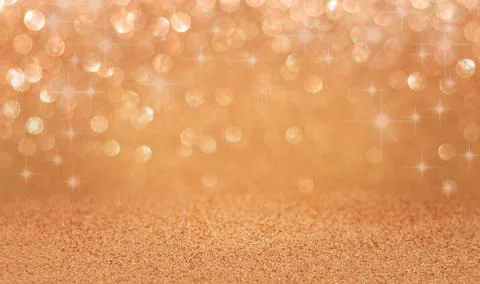 Golden glitter background with bokeh lights and sparkling texture for Stock Photos