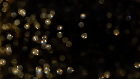 Golden glitter background in slow motion Stock Footage 239416082