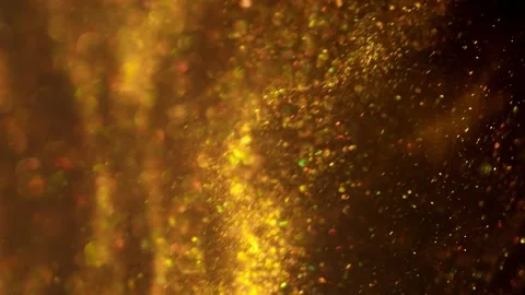 Golden glitter background in slow motion. Beautiful transition with real gold Stock Footage 239623713
