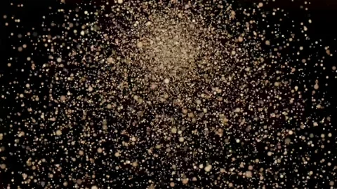Golden Glitter Explosion on Black Background Видео 334587945