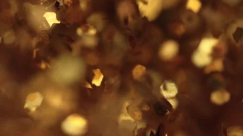 Golden glitter explosion in slow motion Stock Footage 309124053