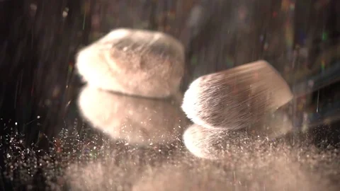 Golden glitter falling on makeup brushes on the black background, abstract slow Stock Footage 75968545