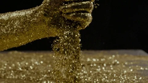 Golden glitter moving , Red Epic slow motion conceptual clip Stock Footage 84724862