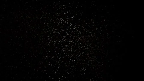 Golden glitter particles creating dynamic shimmering overlay on black background Stock Footage 338386261