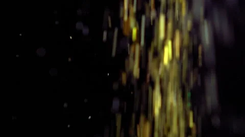 Golden Glitter Particles Falling Down on Black Background Slow Motion Stock Footage 147606757