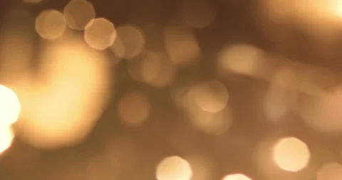 Golden glittering christmas background floating with bokeh, gold holiday happy Stock Footage 278029655