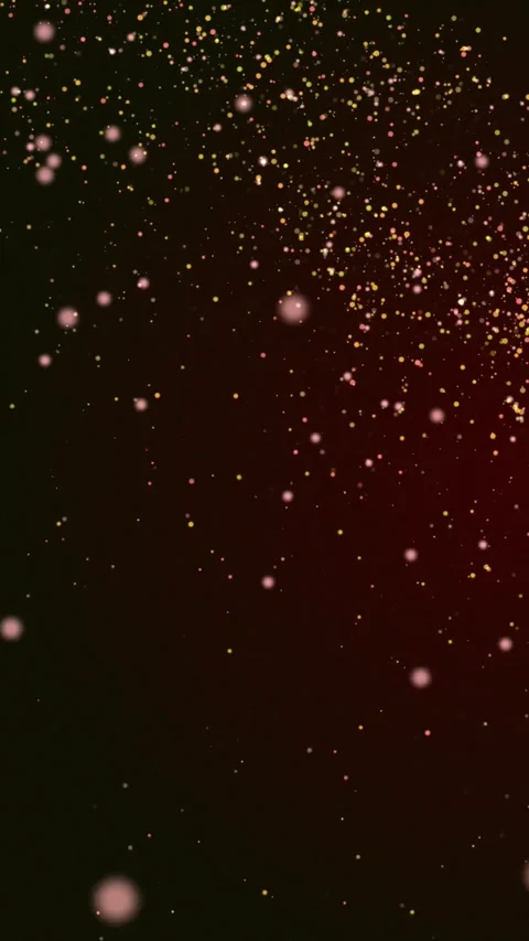 Golden glowing embers floating up on dark red background Stock Footage 345653580