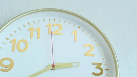 Golden hands of wall clock are moving slowly on a white face. Stock Footage 269671604