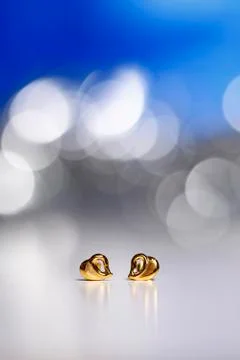 Golden heart earring gift Stock Photos