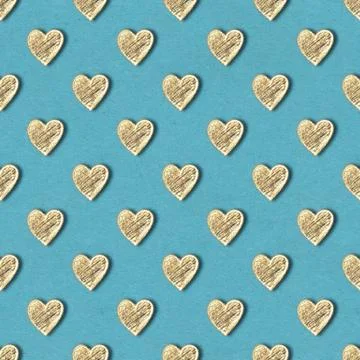 Golden hearts seamless pattern on blue background Stock Illustration