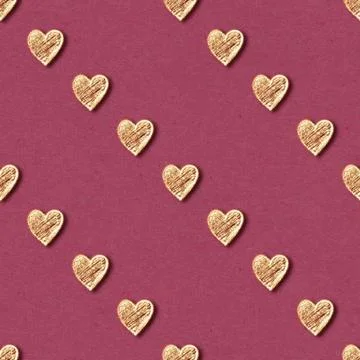 Golden hearts seamless pattern on red background Stock Illustration