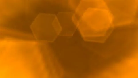 Golden hexagons float softly across warm amber tones Stock Illustration