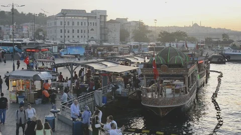 Golden Horn floating boat kitchen restaurants with people dining at sunset Stock Footage 90498024