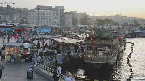 Golden Horn floating boat kitchen restaurants with people dining at sunset Stock Footage 90498121