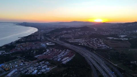 Golden Hour Aerial Slow Pan Over Alella &amp; Highway Towards Barcelona | 4K Stock Footage 303021053